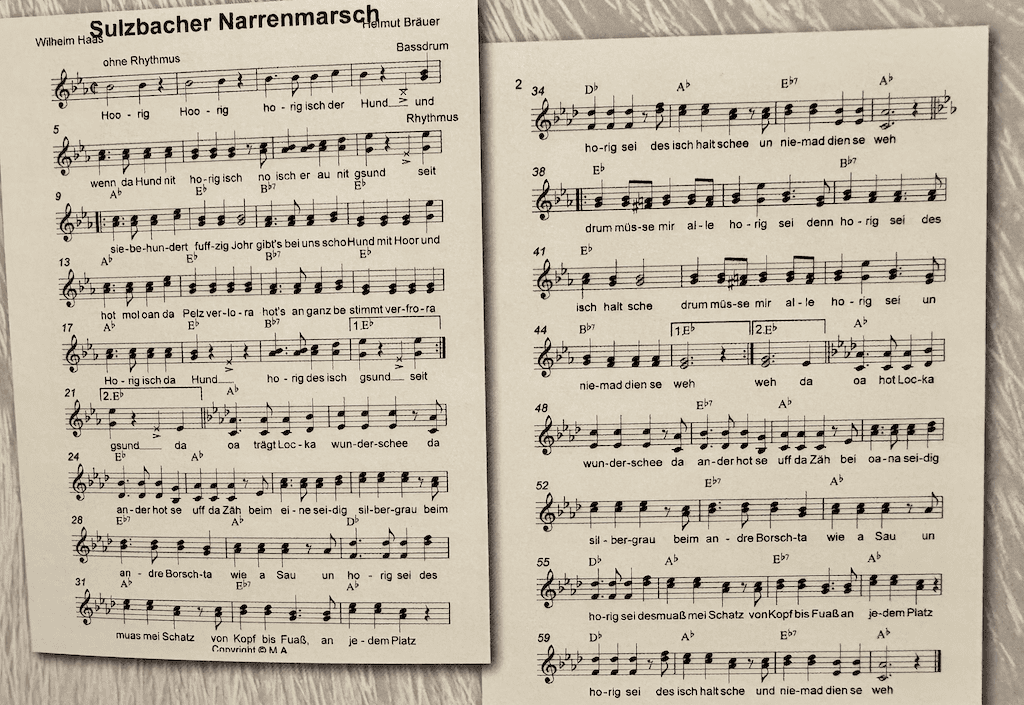 Hooriger Hund, musikalisches Notenblatt mit Songtext zum Sulzbacener Narrenmarsch, ideal für Hundeliebhaber und Musikenthusiasten, traditionelles deutsches Volkslied, nostalgische Stimmung.